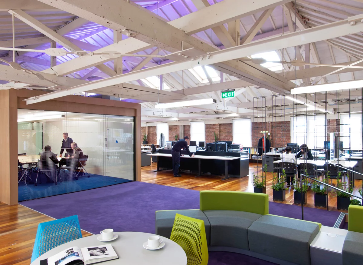 Open plan office reception with purple rug