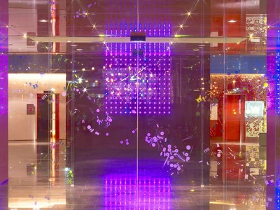 Hotel lobby with purple neon lights and glitter