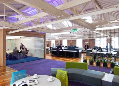 Open plan office reception with purple rug